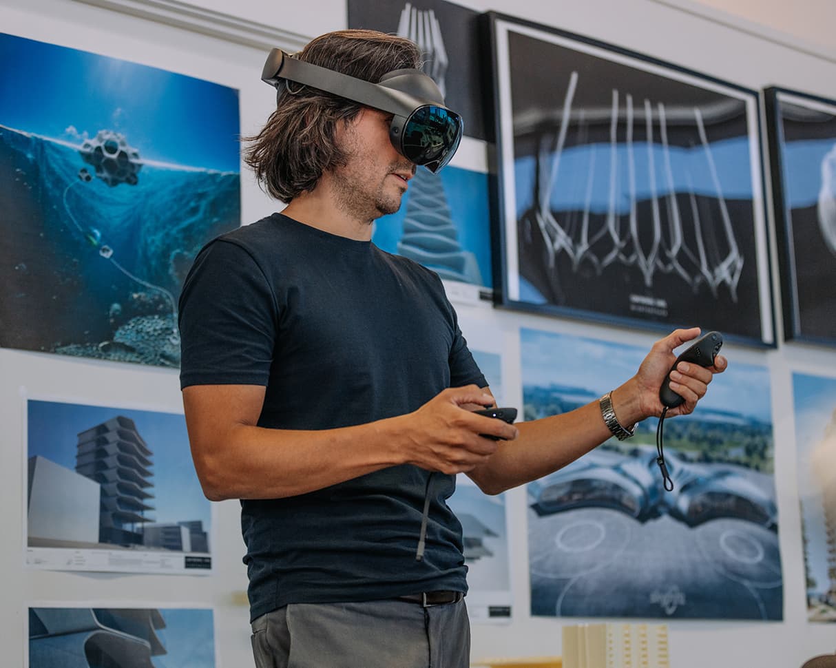 A man using a Virtual Reality headset.