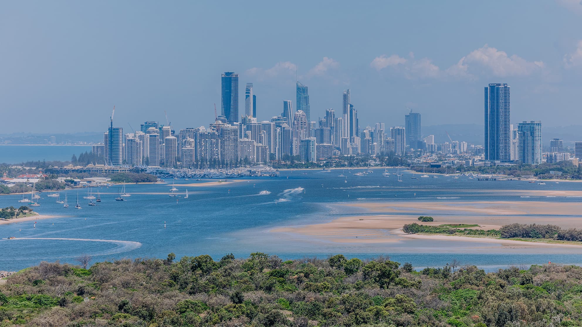 Trees and waterways in front of the city.