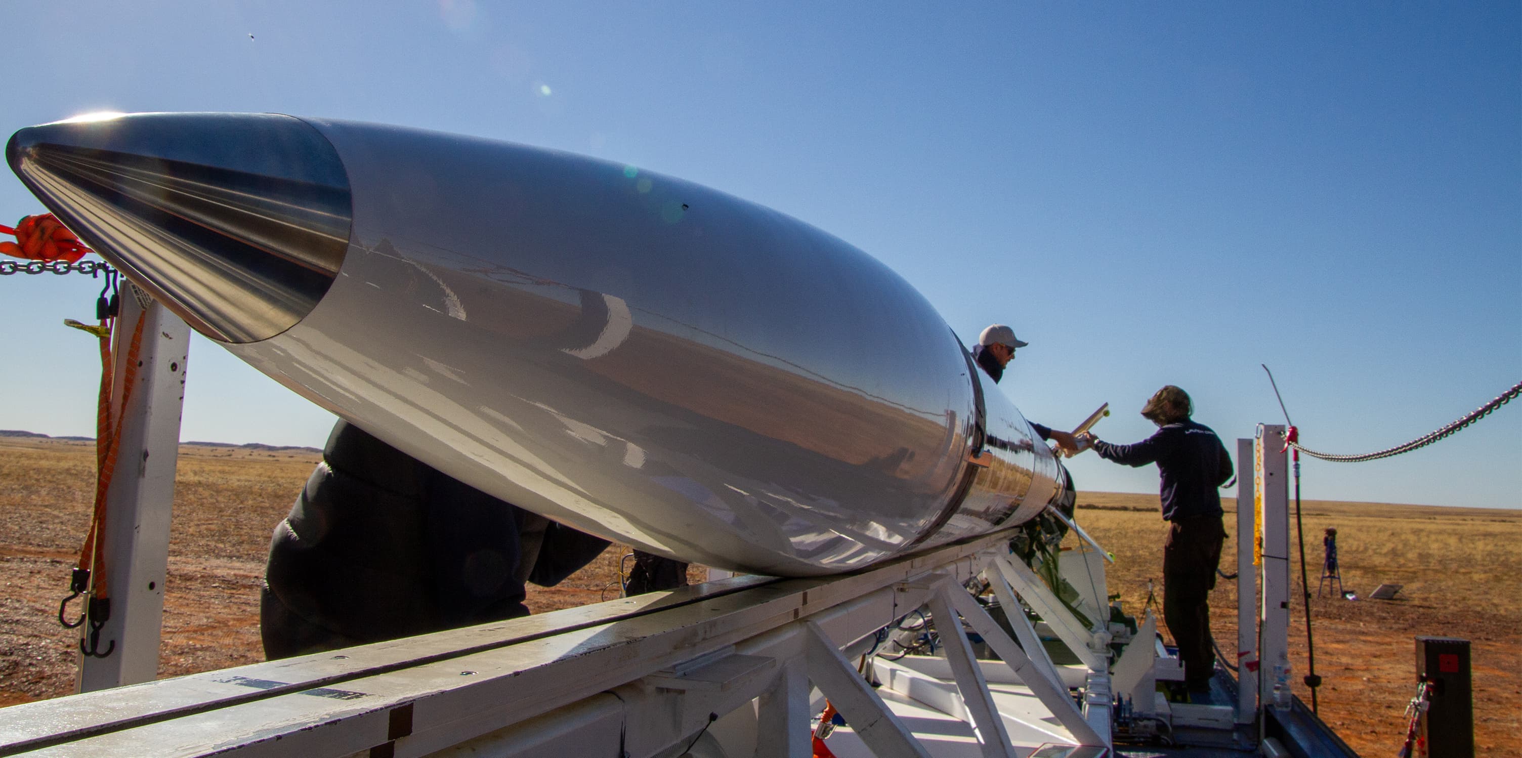 Technicians working on a rocket for Gilmour Space Technologies.