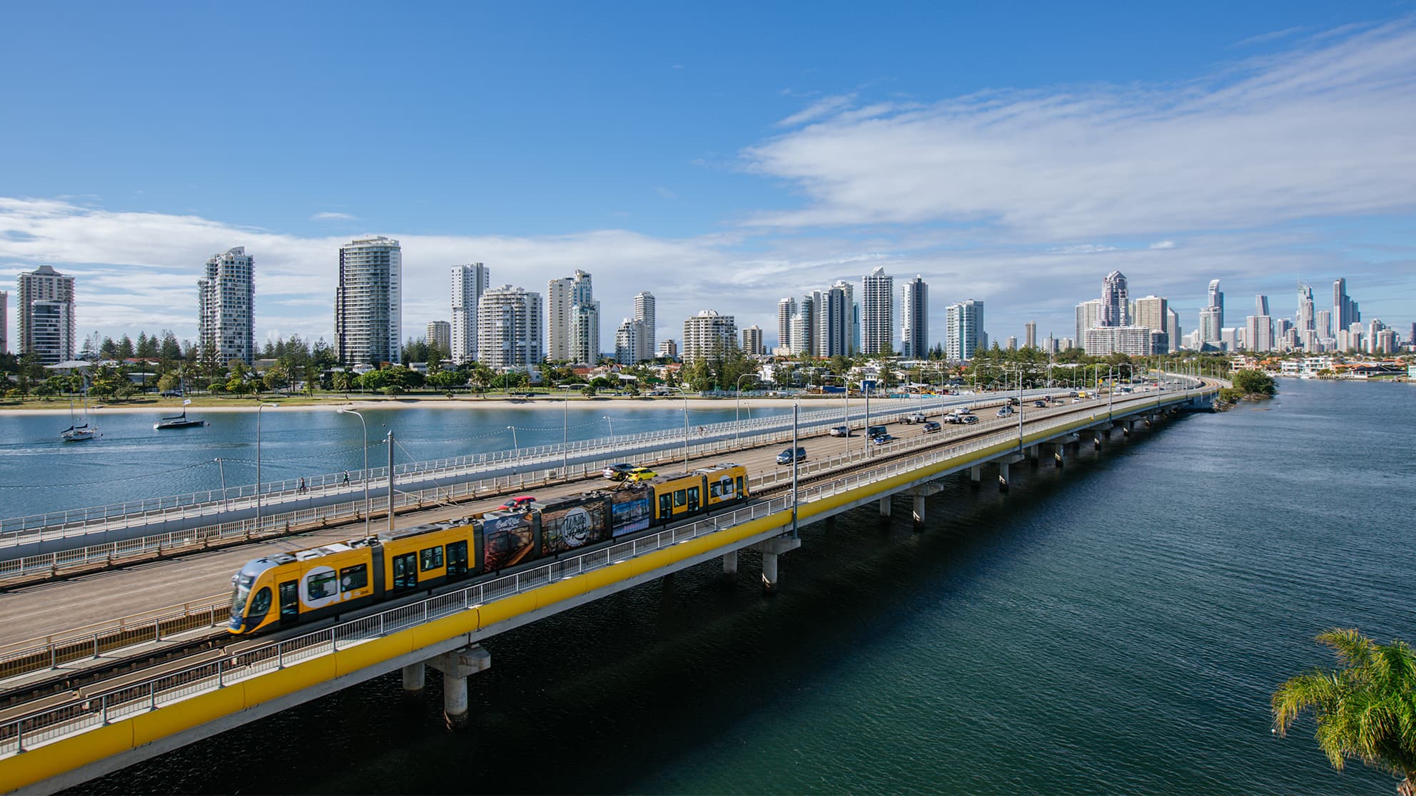 Gold Coast Light Rail tram goes over the Sundale Bridge.