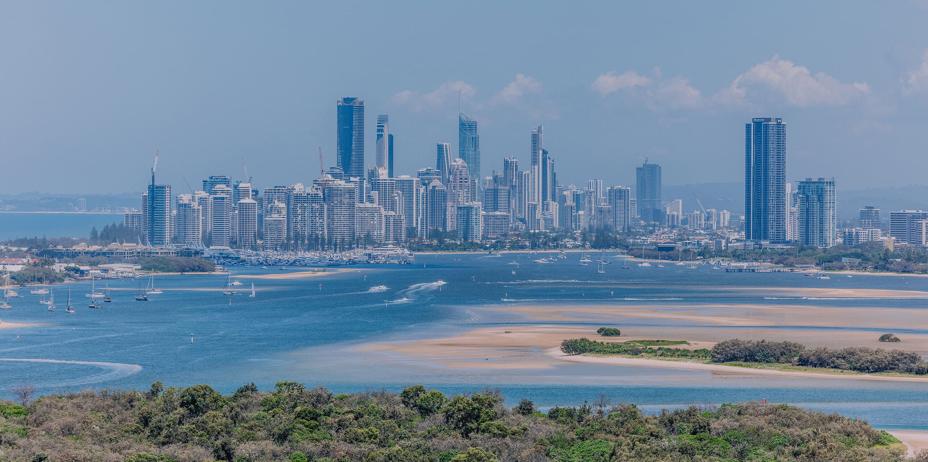Aerial view of The Broadwater and city skyline from Wave Break island.
