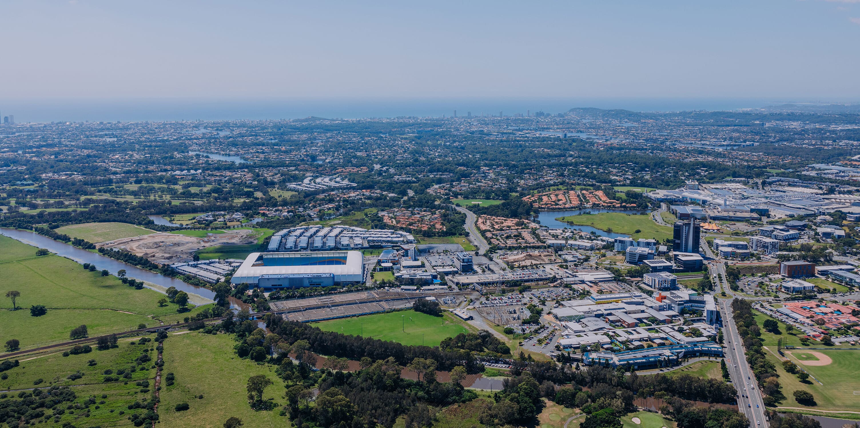 Aerial view of central Gold Coast showing CBUS Stadium. Robina Town Centre and Greenheart.