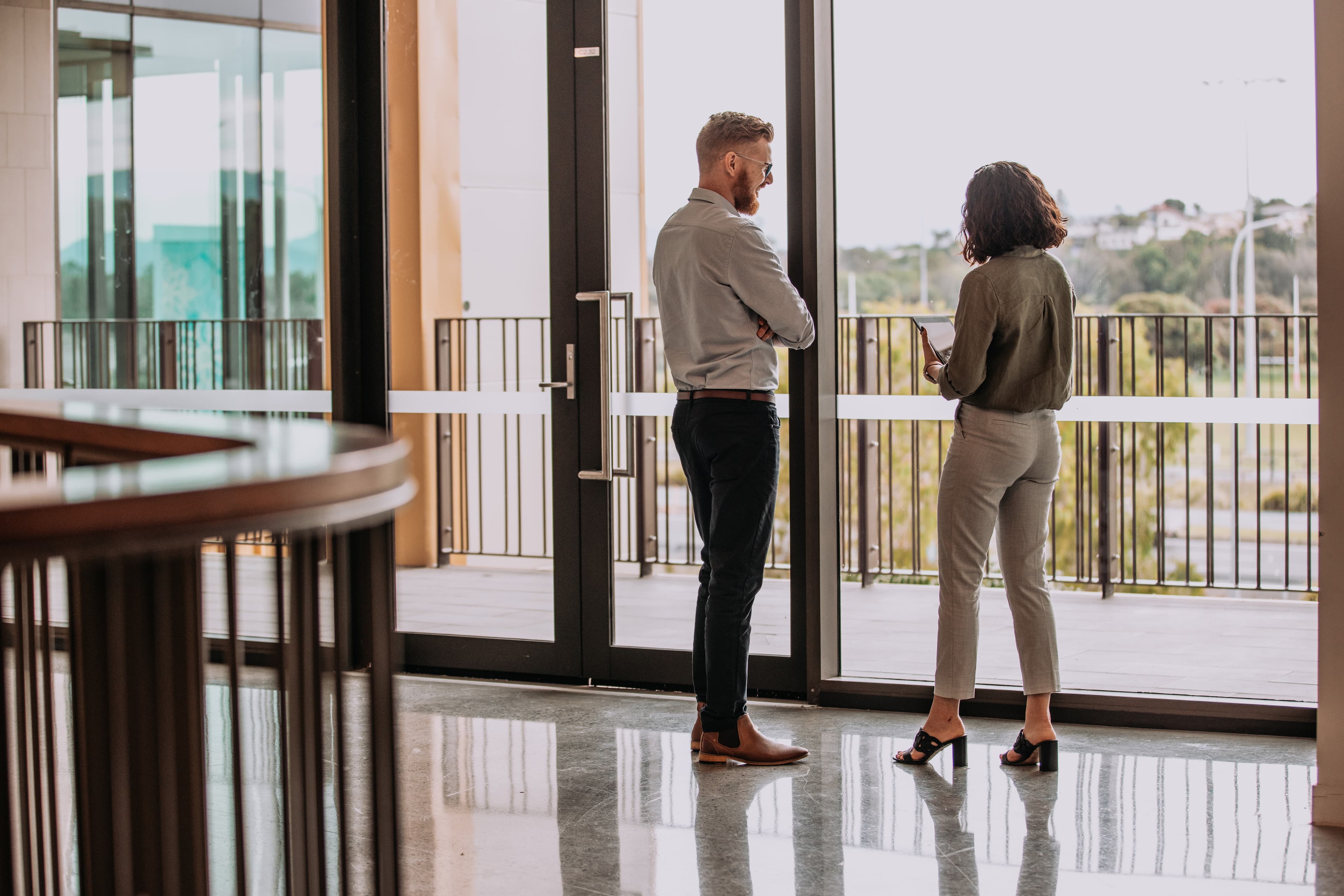 Two professional people in happy conversation.