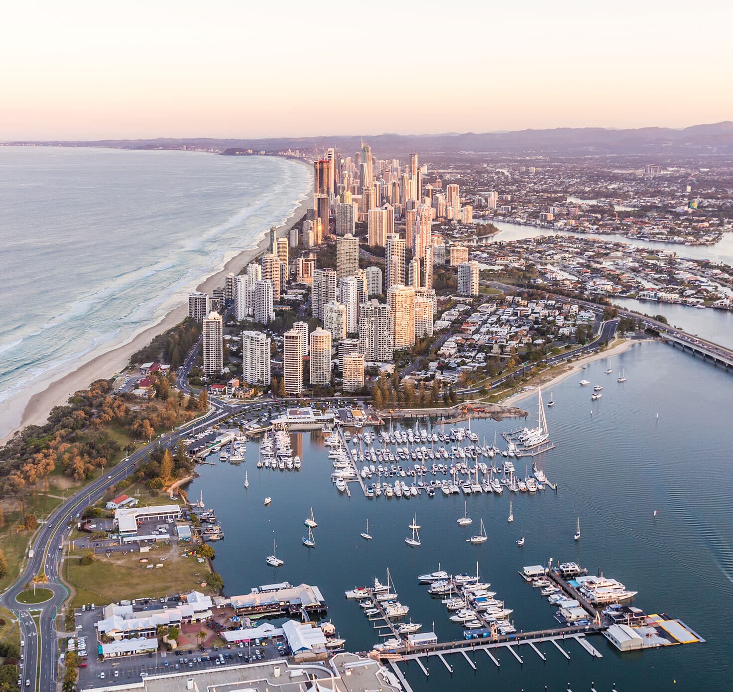 Aerial view over the water and Gold Coast skyline.