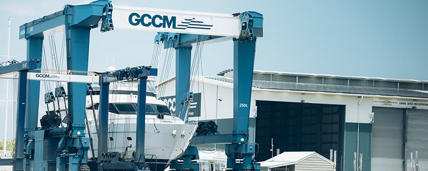 A boat in a lift for maintenance at Gold Coast City Marina.