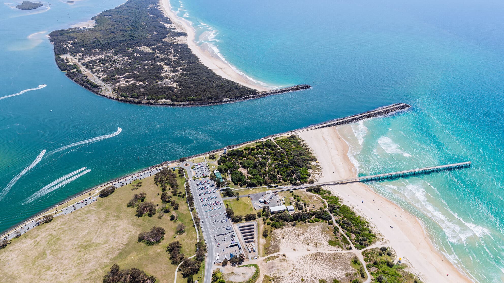 Marine craft heading out toward the ocean at The Spit, Gold Coast.